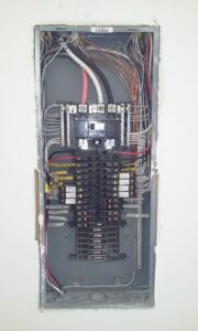 A close up of an electrical panel with wires
